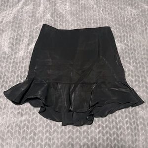 This is a cute short black skirt. It has a nice little flare out at the bottom.